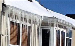 house with icicles and ice dam