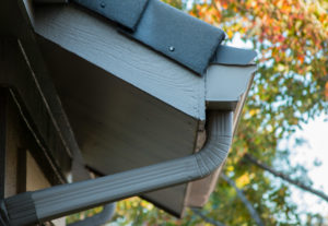 gutter elbow featured in a guttering system