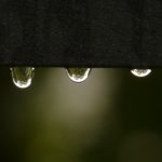Picture of water drips as example of surface tension employed by Gutter Cover