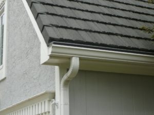 Charcoal Gutter Cover Installed on Steel Roof