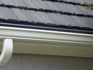 Close Up View of Stone Coated Steel Roof With Gutter Cover Installed