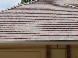 Tile roof with dessert sand gutter cover installation