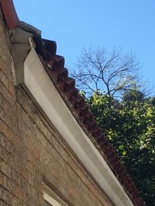 slanted fascia install on spanish tile roof