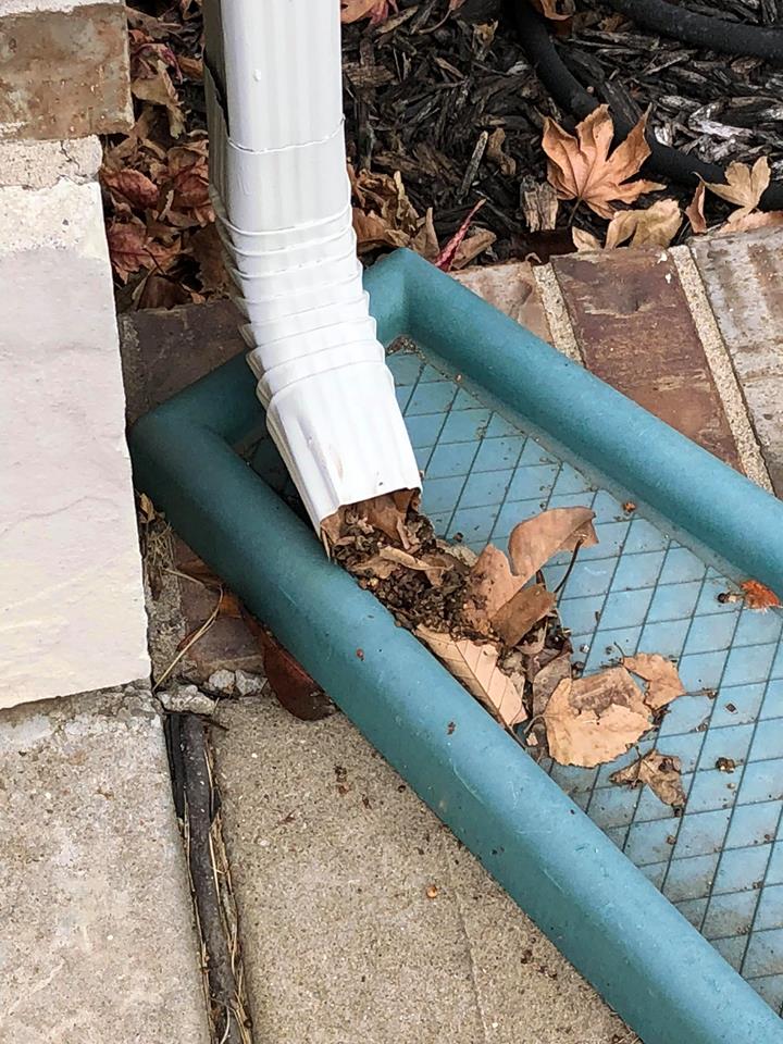 clogged downspouts causing issues to homes