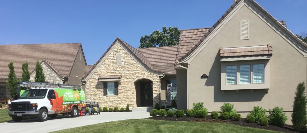 Leawood home with stone coated steel roof with gutter guards installed