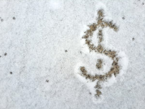 dollar-sign-drawn-in-snow-indicating-savings